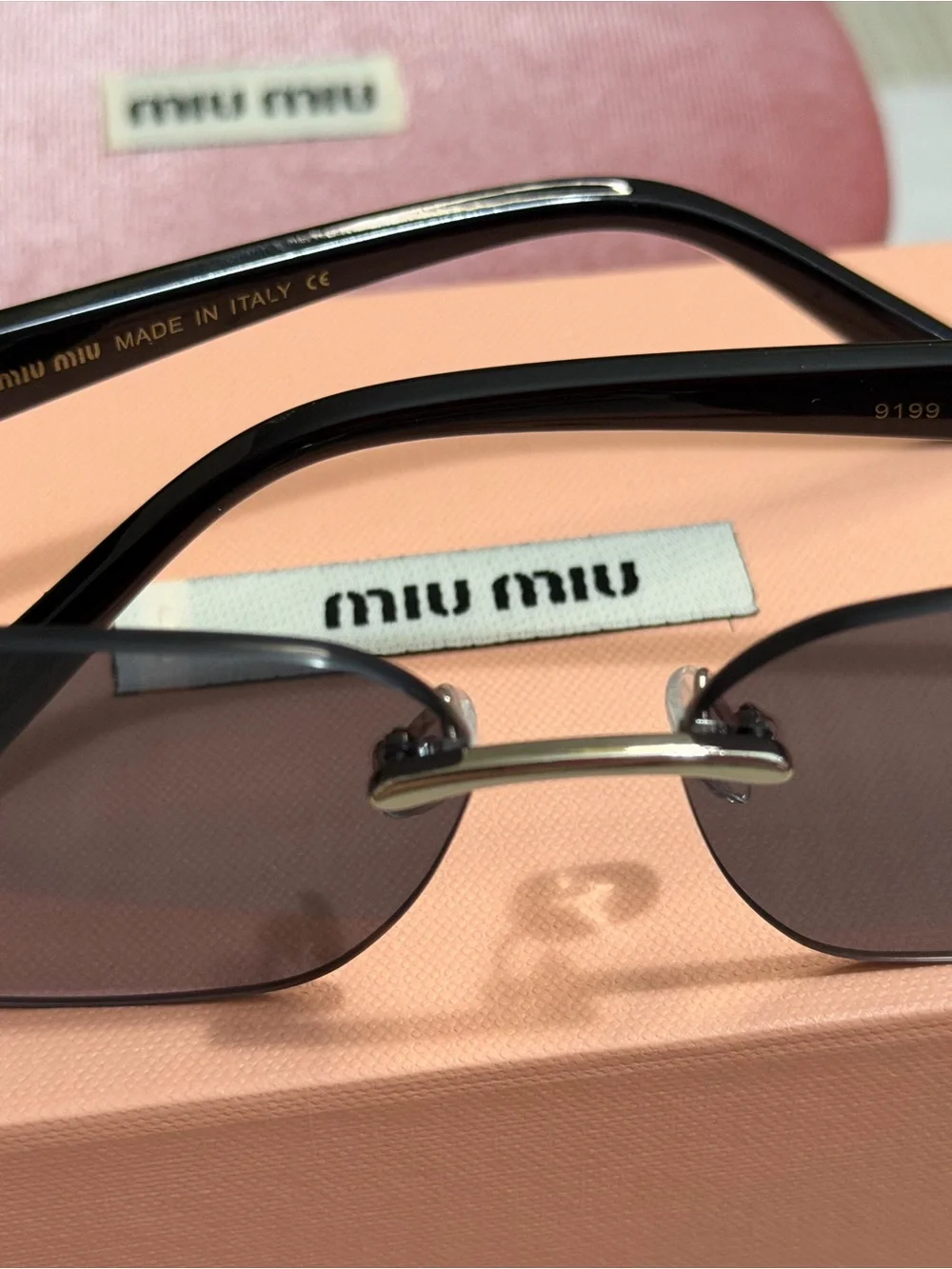 Miu Miu Slim Rectangular Sunglasses in Plum Tint